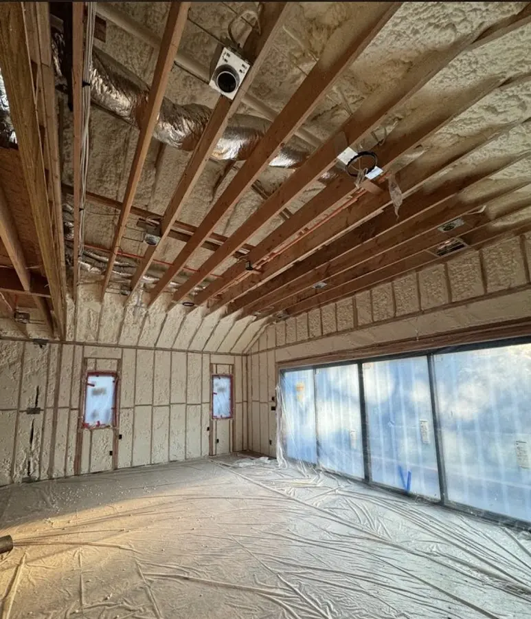 Interior walls and ceiling insulated with spray foam during new construction in Shady Hollow